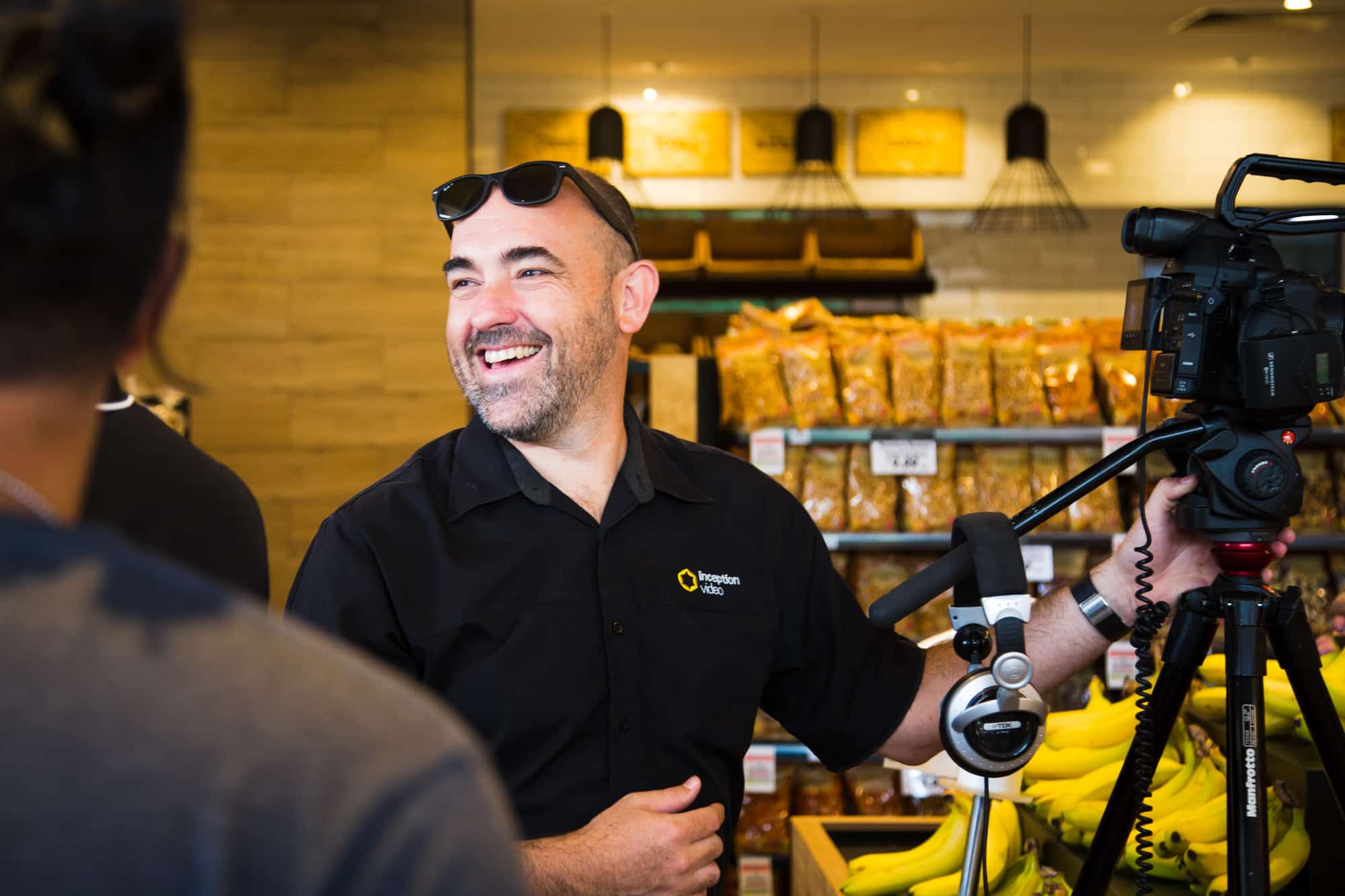 Michael Jepson working with a video camera during a shoot.