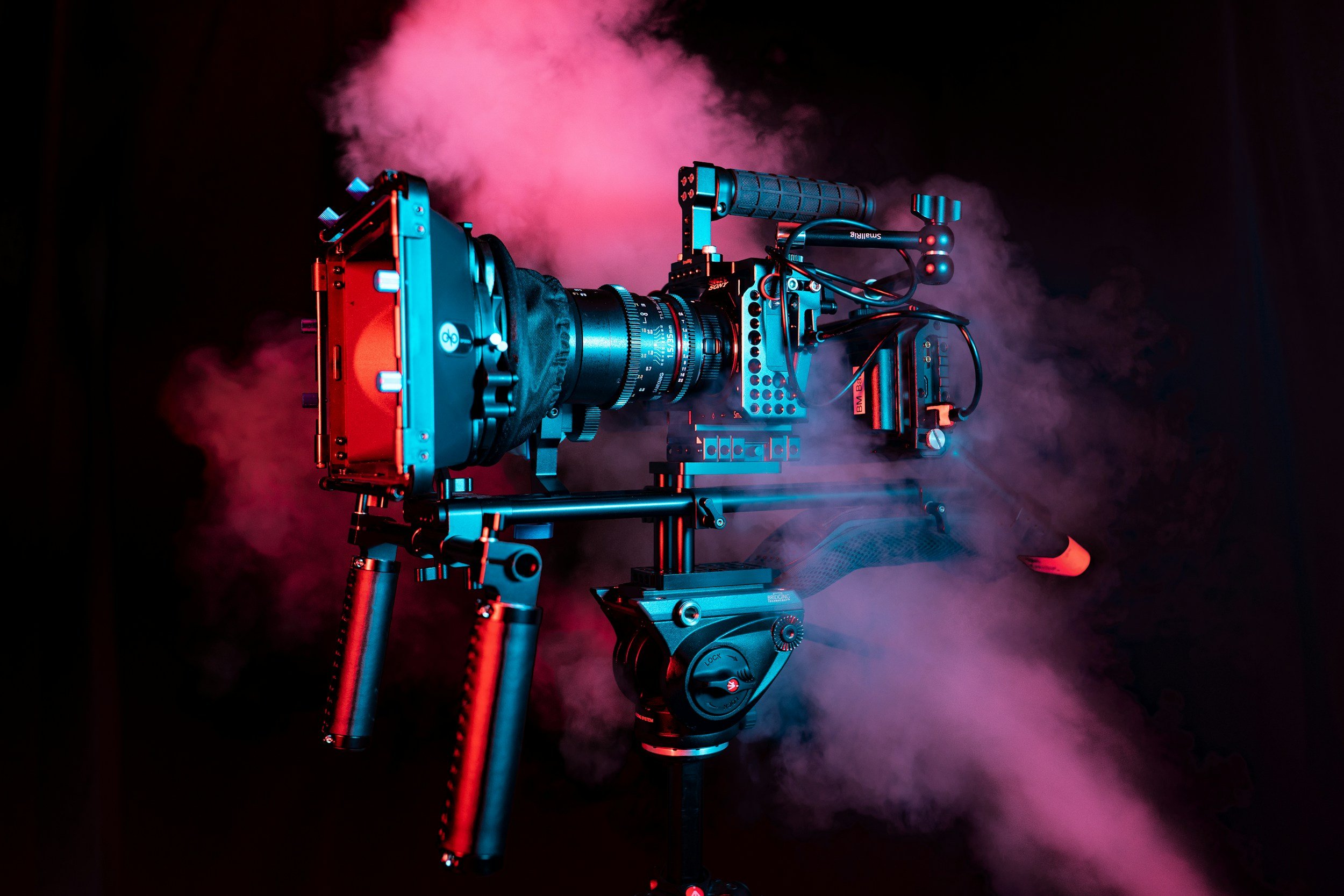 video camera in dramatic light with smoke behind